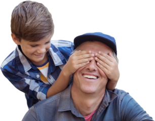 Little boy hiding his fathers eyes with his hands