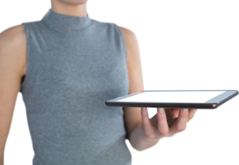 Mid section of businesswoman holding tablet computer