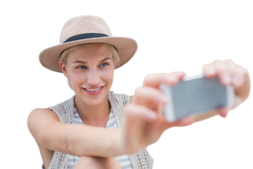 Beautiful woman smiling while talking selfie using mobile phone