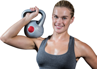 Muscular woman swinging heavy kettlebell