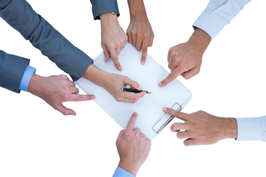 Businesswoman writing on clipboard while colleagues pointing on it