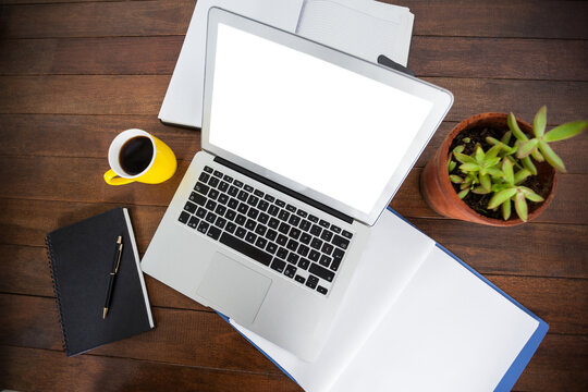 Overhead view of office desk with laptop and documents - Powered by Adobe
