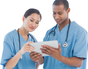 Surgeons looking at digital tablet in hospital