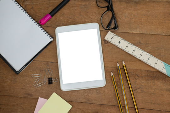 Overhead view of digital tablet with school supplies and eyeglasses - Powered by Adobe
