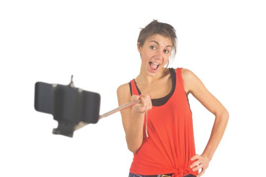 Casual brunette using selfie stick
