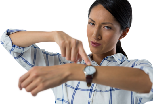 Female executive pointing at her wristwatch - Powered by Adobe