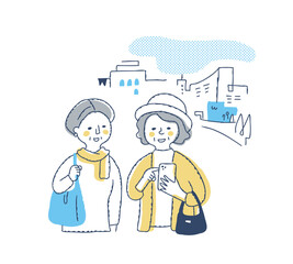 外出先でスマホを操作するシニア女性