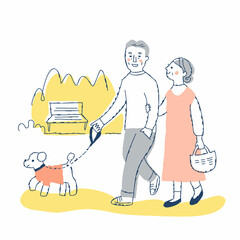 犬の散歩をするシニアカップル