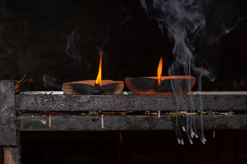 Two lamps and few incense sticks for puja or worship at Kamakhya Temple.