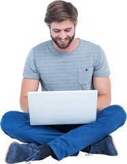 Smiling young man using laptop 