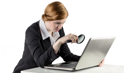 Redhead businesswoman using her laptop