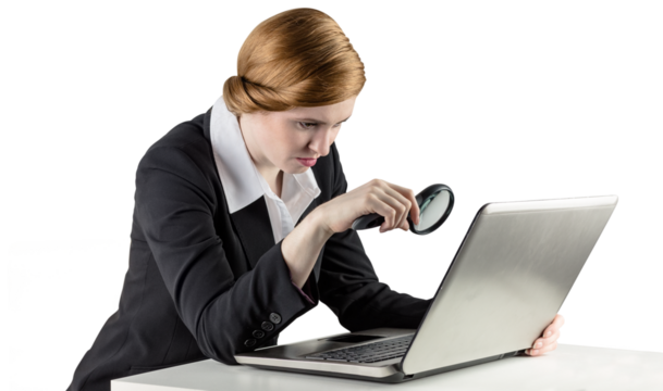 Redhead businesswoman using her laptop - Powered by Adobe