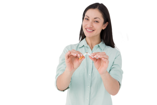 Smiling woman snapping cigarette in half - Powered by Adobe