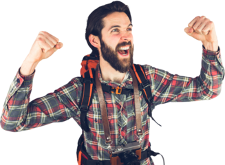 Excited hiker with arms raised 