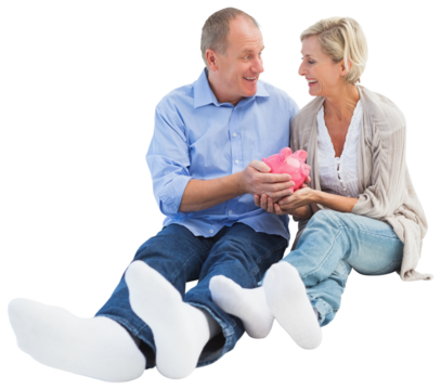 Happy mature couple holding piggy bank