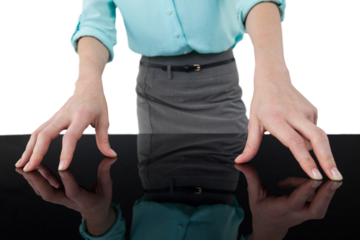 Midsection of businesswoman using digital screen