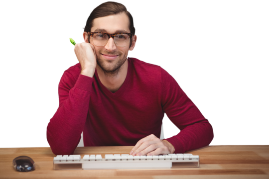 Portrait of confident man sitting at desk