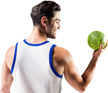 Happy athlete male holding a ball 