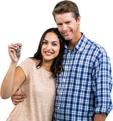 Portrait of couple embracing while holding keys