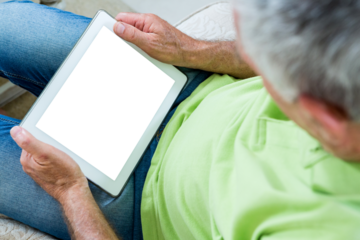 Old man holding digital tablet
