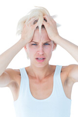 Sad blonde woman with head pain holding her head 