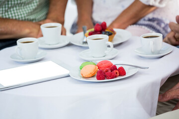 People with food and drink in office