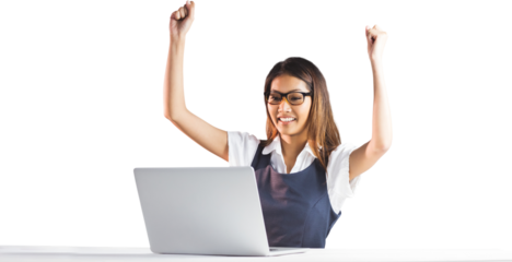 Happy businesswoman using laptop and raising arms