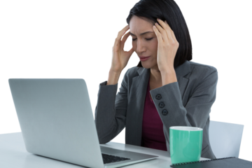 Businesswoman with laptop suffering from headache