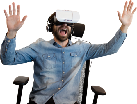 Cheerful man using virtual reality glasses while sitting on armchair