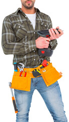 Manual worker holding gloves and hammer power drill 