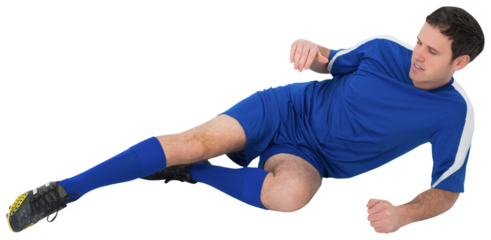 Football player in blue kicking