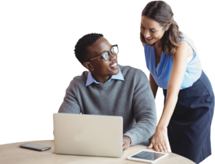 Smiling business people discussing over laptop