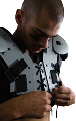 American football player adjusting chest pad