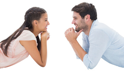 Attractive young couple smiling at each other