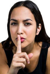 Naklejka premium Close-up portrait of woman with finger on lips
