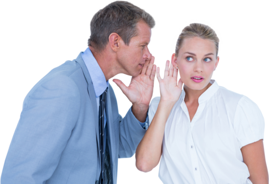 Businessman telling secret to a businesswoman