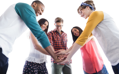 Low angle view of business people huddling hands
