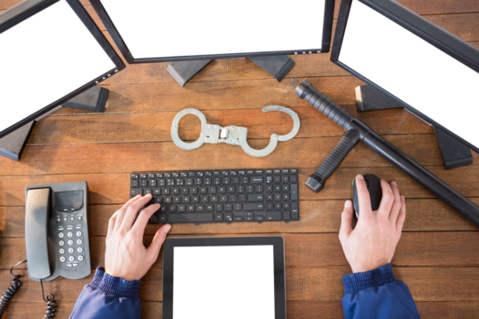 Hands of security officer using computer