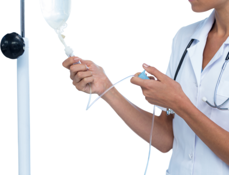 Midsection of female doctor adjusting IV drip