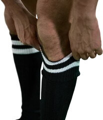 Football player pulling his socks up