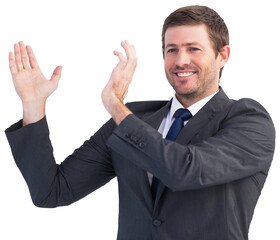 Smiling businessman showing something with his hands