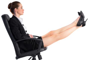 Businesswoman sitting on swivel chair with feet up