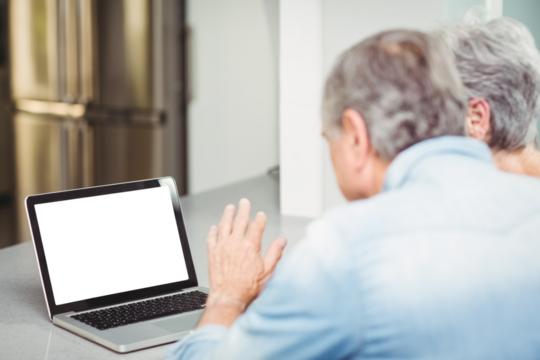 Senior couple using laptop - Powered by Adobe