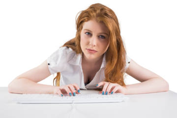 Pretty redhead typing on keyboard 