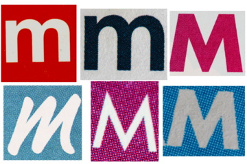 Letter font m from printout magazine cut out, collage element.