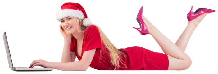 Festive blonde using a laptop