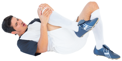 Injured football player holding knee while lying down