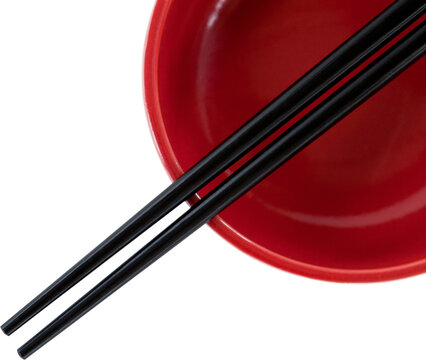 Close up of black chopstick with bowl