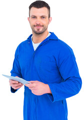 Happy mechanic pointing on digital tablet