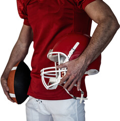 Midsection of player holding rugby ball and helmet
